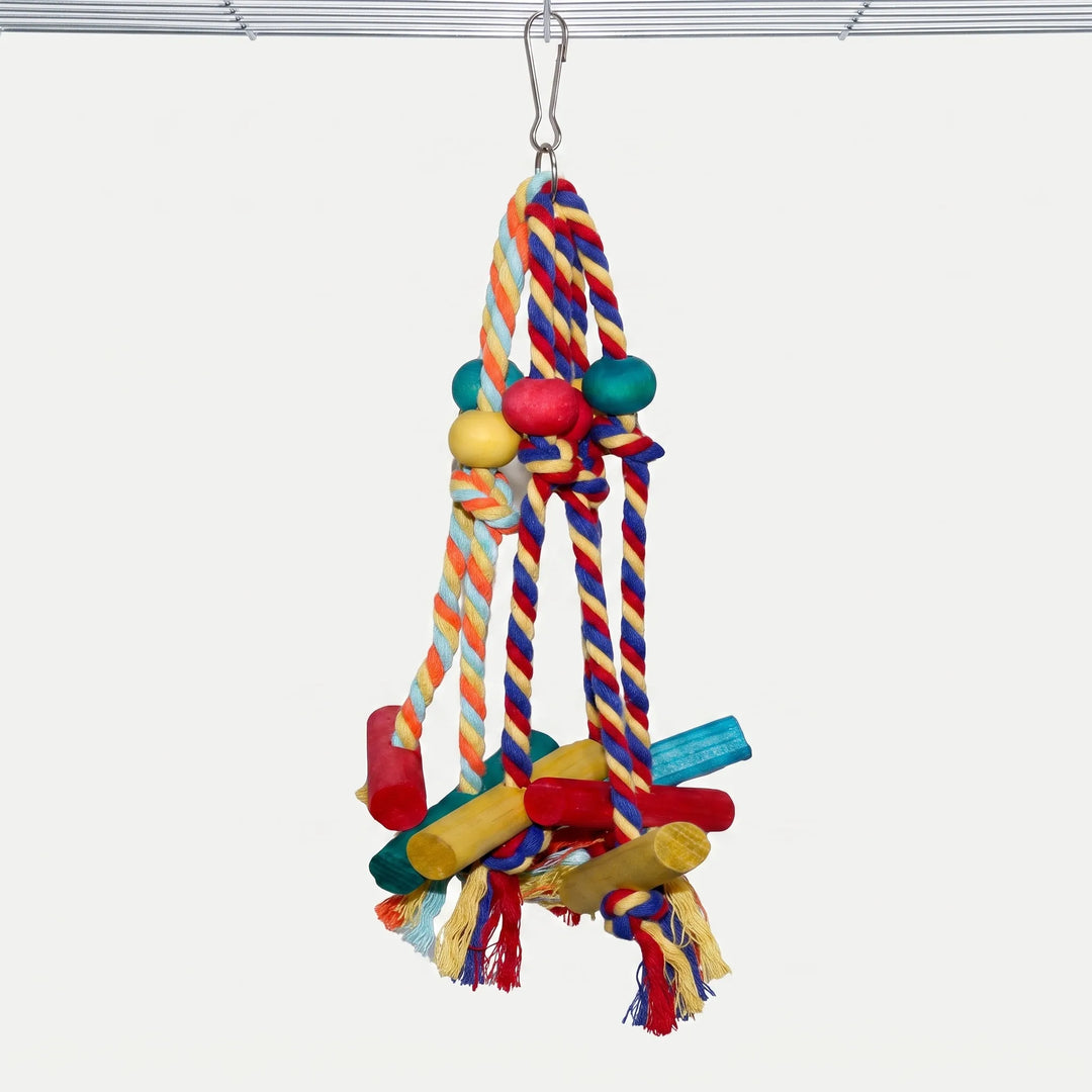 Colourful hanging bird toy with ropes and wooden blocks suspended from a cage ceiling