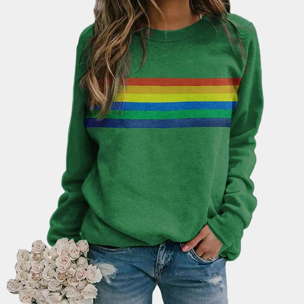 Woman wearing green rainbow stripe crewneck sweatshirt holding flowers