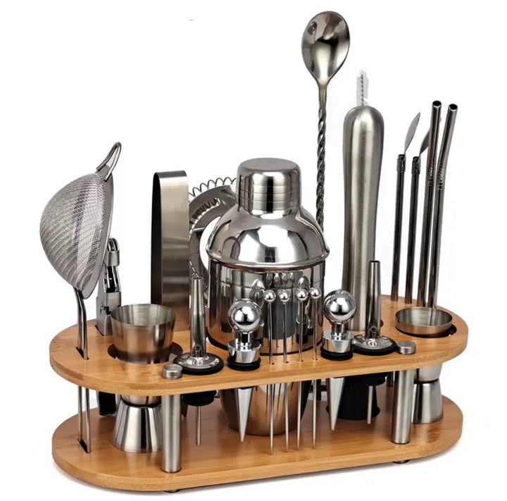Complete 23-piece cocktail shaker set with stainless steel tools on a wooden stand