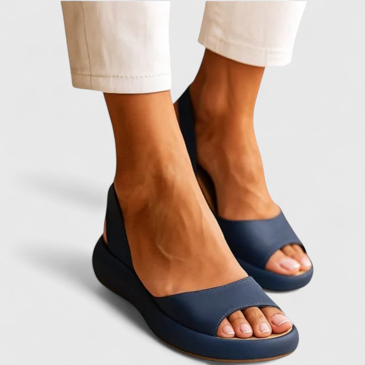 Model wearing navy blue peep toe slingback flatform sandals
