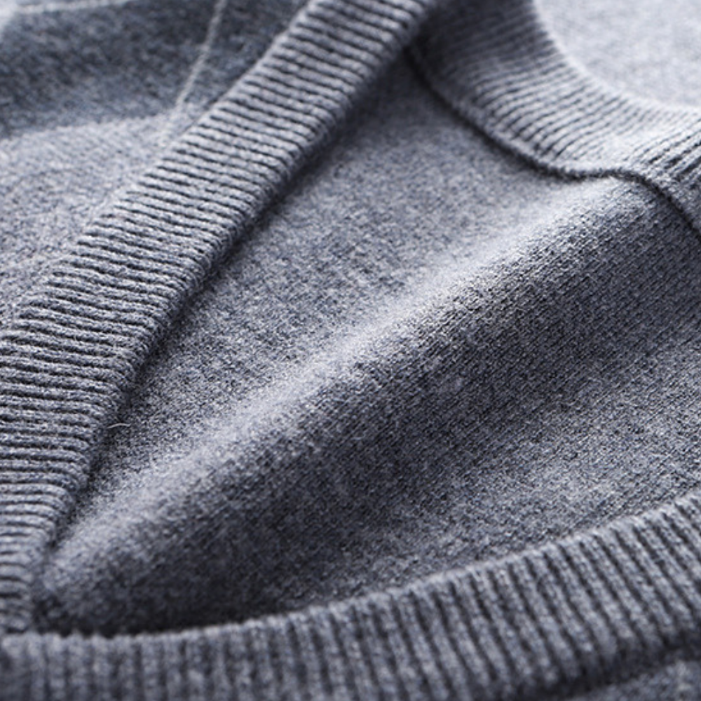 Flat lay of the mens argyle V-neck knit vest ready for styling