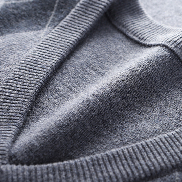 Flat lay of the mens argyle V-neck knit vest ready for styling