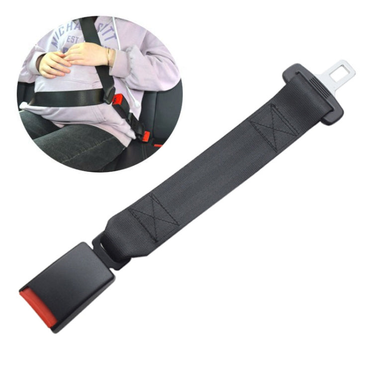 Universal seatbelt extender shown in use by a driver