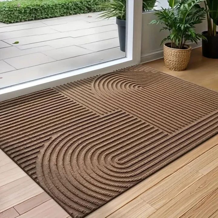 Modern entryway mat showing grey and white wave design details