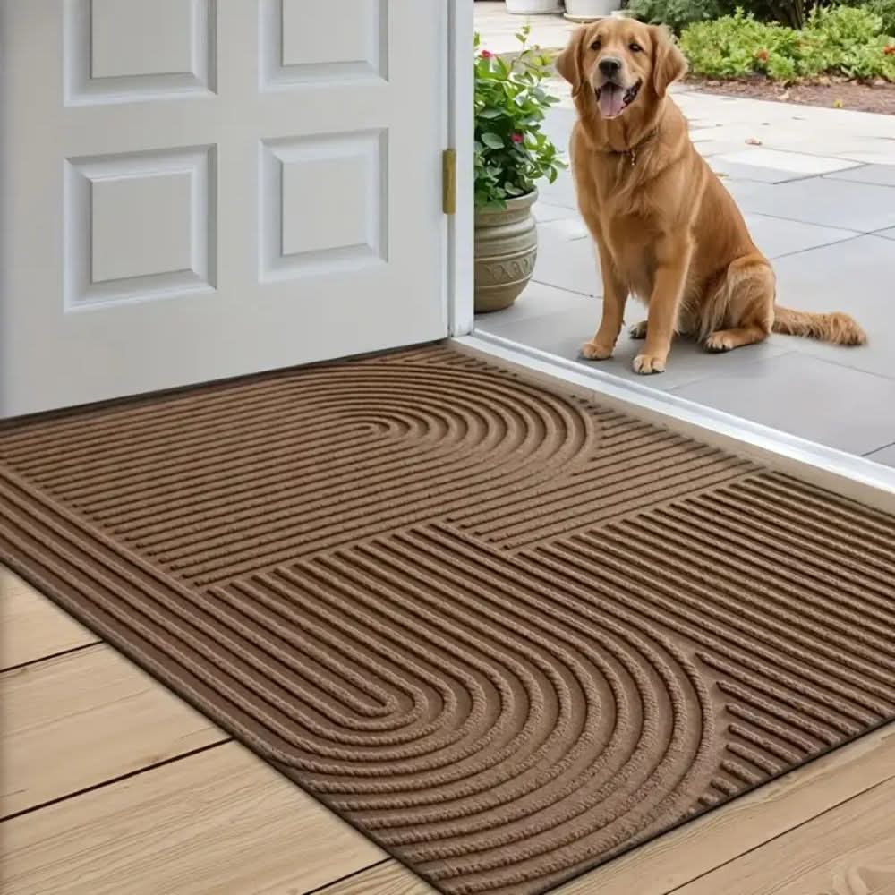 Durable indoor floor mat placed neatly in front of a front door