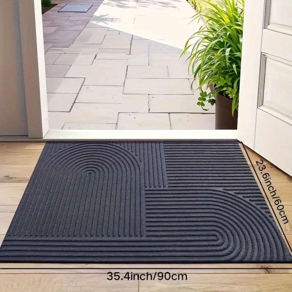 Machine washable home decor doormat laid flat on hardwood floor