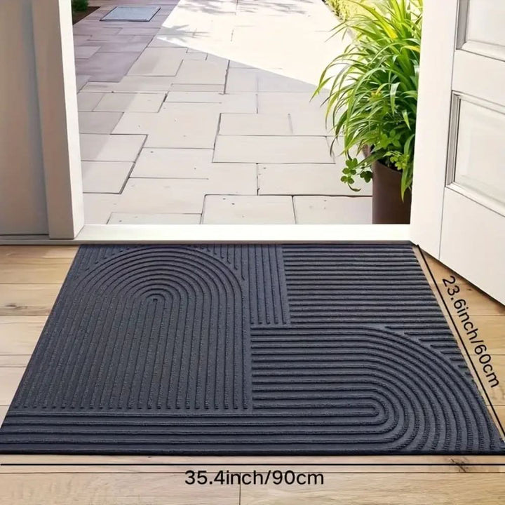 Machine washable home decor doormat laid flat on hardwood floor