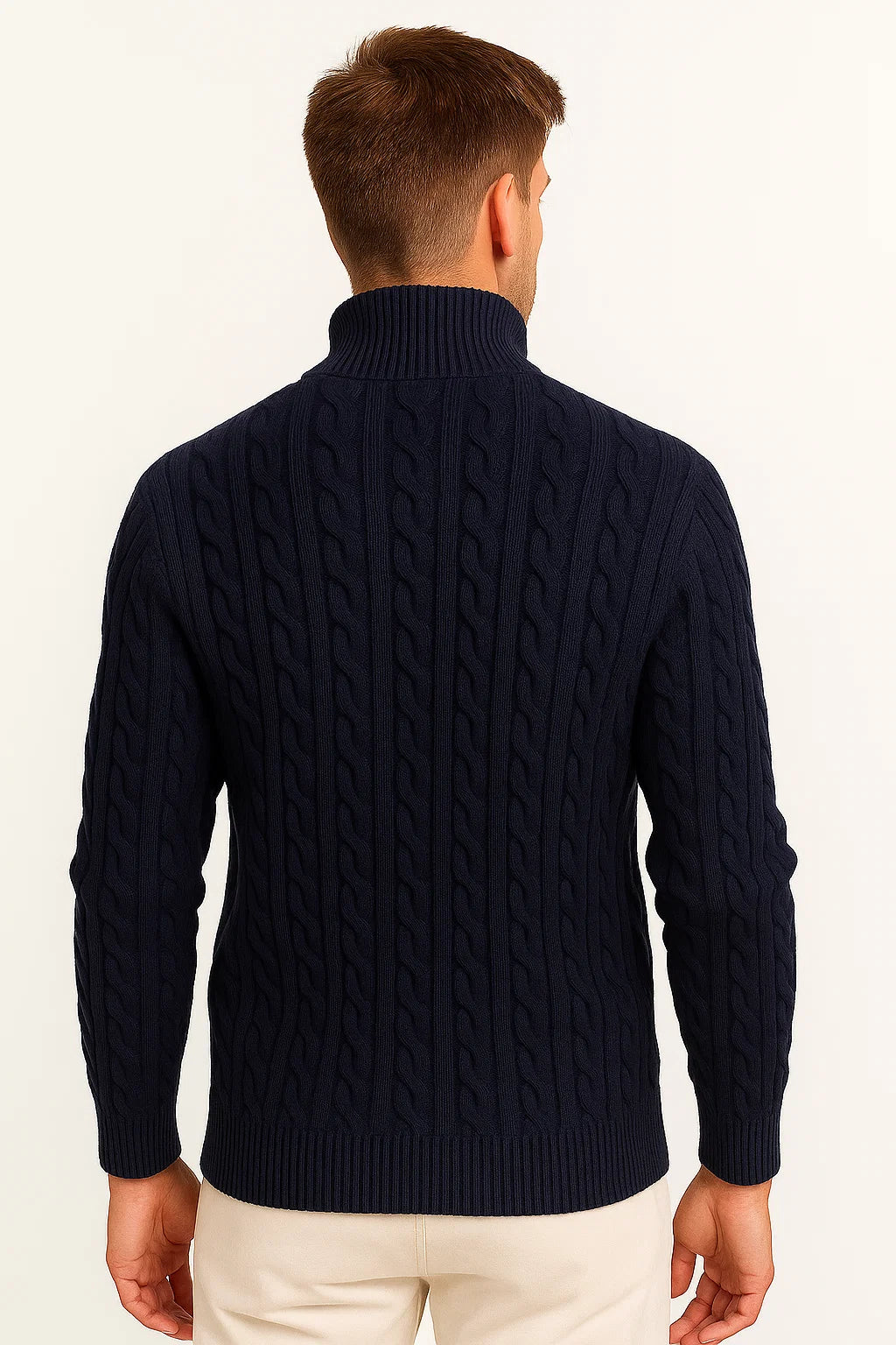 Back view of a man wearing a dark blue quarter zip cable knit jumper