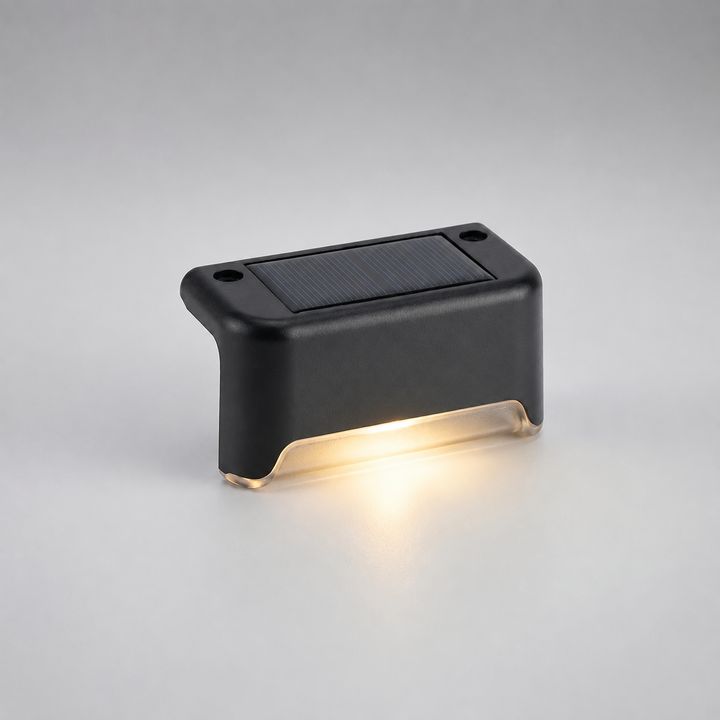Outdoor wall lights casting a bright beam downwards on a patio surface
