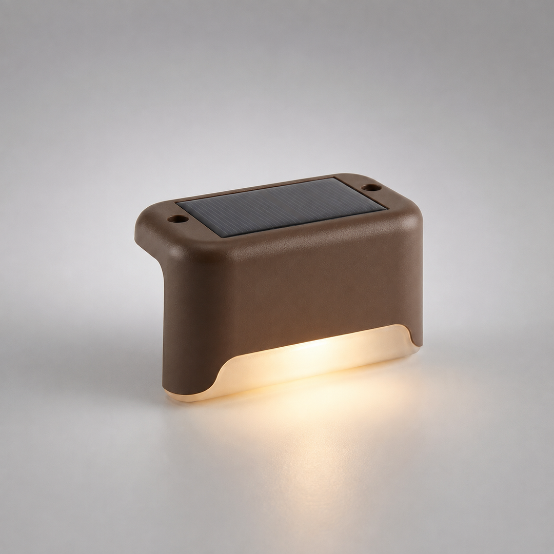 Brown solar step light casting a warm glow against a neutral studio background