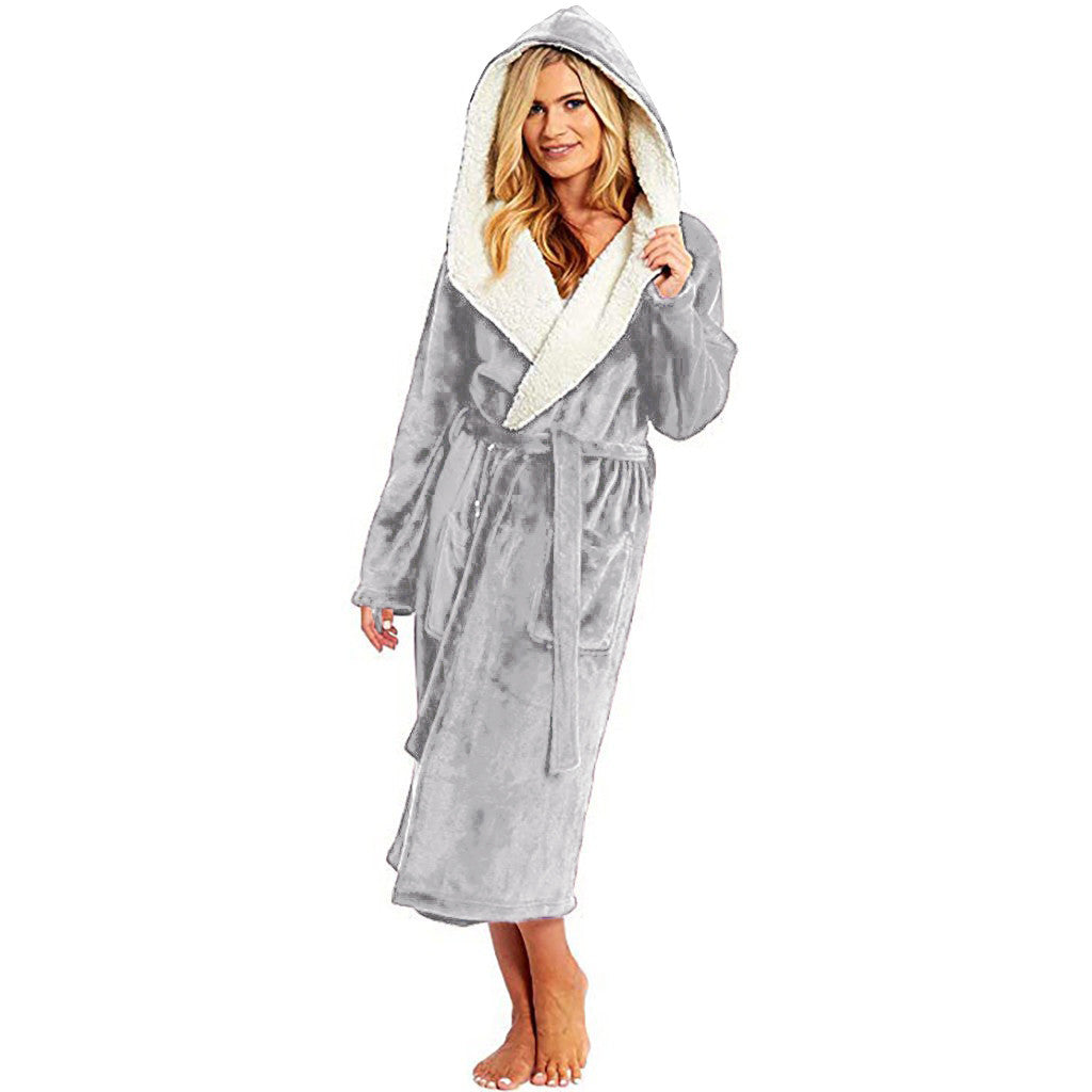 Woman wearing a grey hooded dressing gown with a soft wrap belt