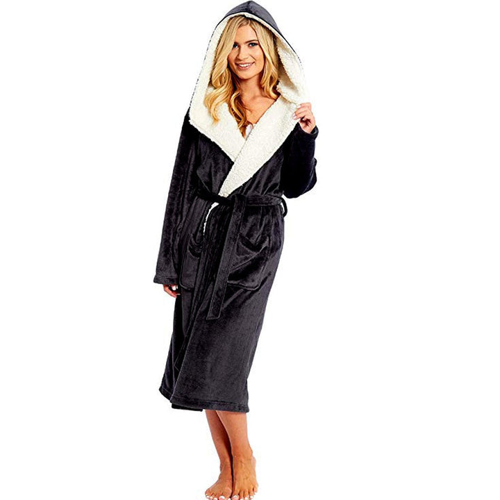 Woman wearing a black hooded dressing gown with a cozy contrasting lining