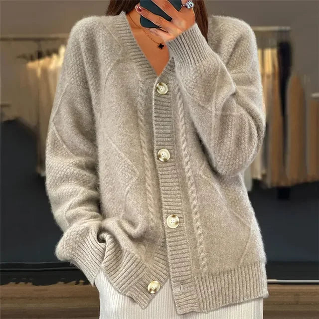 Woman wearing a beige soft knit button cardigan sweater