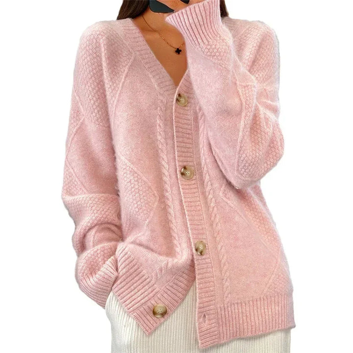Flat lay of womens winter clothing knit cardigan sweater highlighting texture and design
