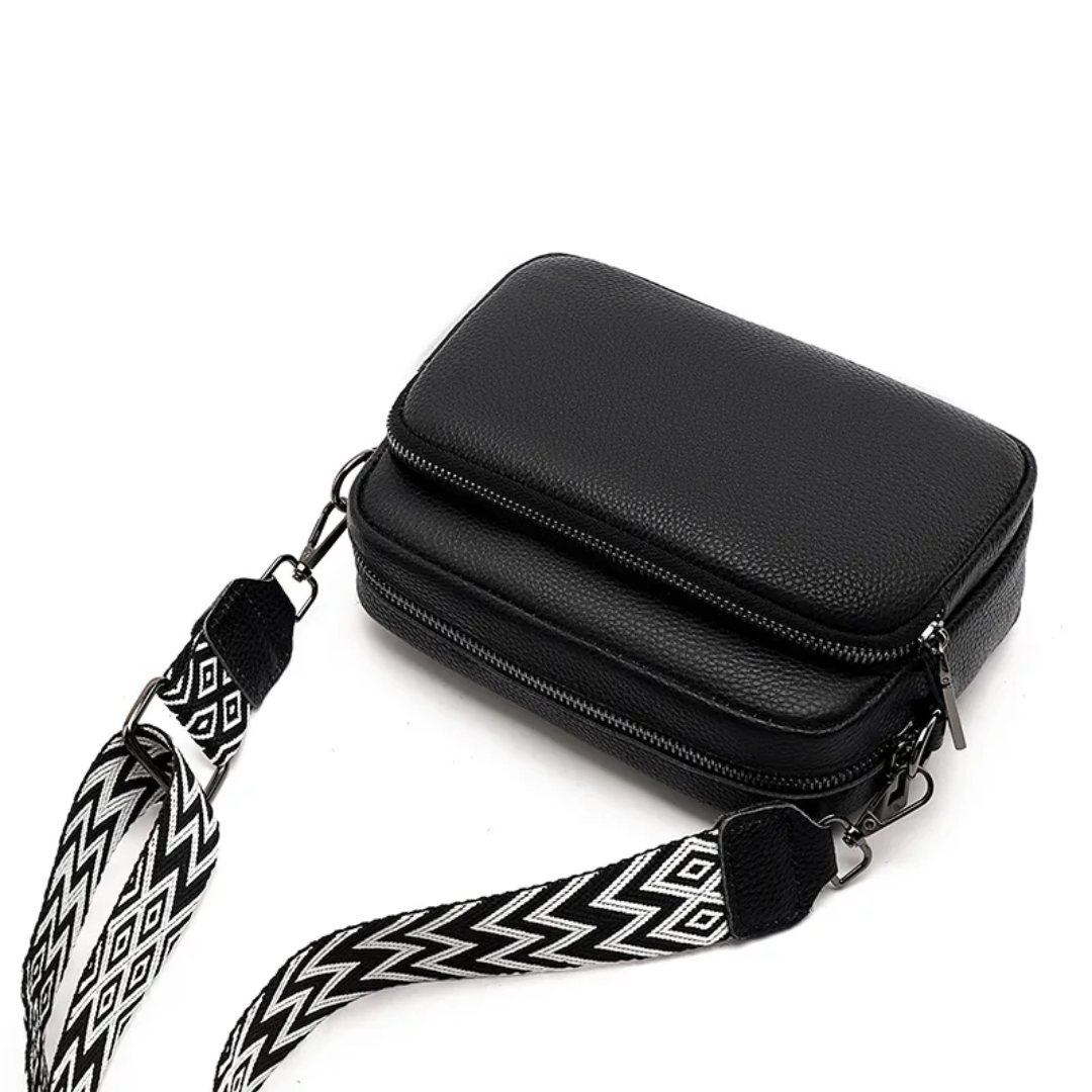 Stylish brown leather crossbody bag with adjustable strap