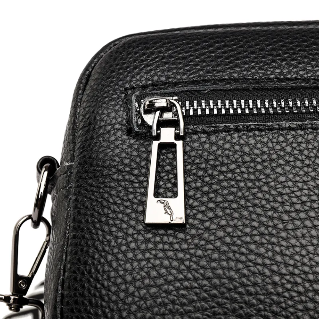 Versatile messenger bag worn across the body by a model