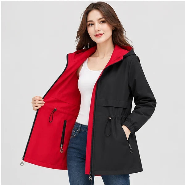 Close-up of a woman showcasing the black and red reversible parka