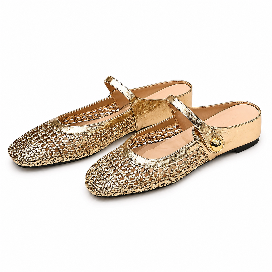 Pair of gold woven fabric square toe clog mules with Mary Jane strap on a white background