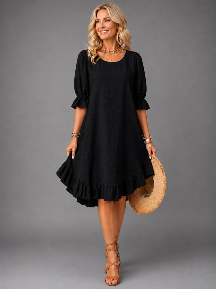 Comfortable women's casual dress in versatile black, side angle view