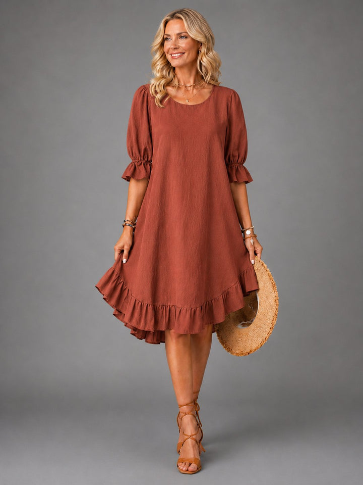 Relaxed fit women's dress in rich brown color, back view showing drape