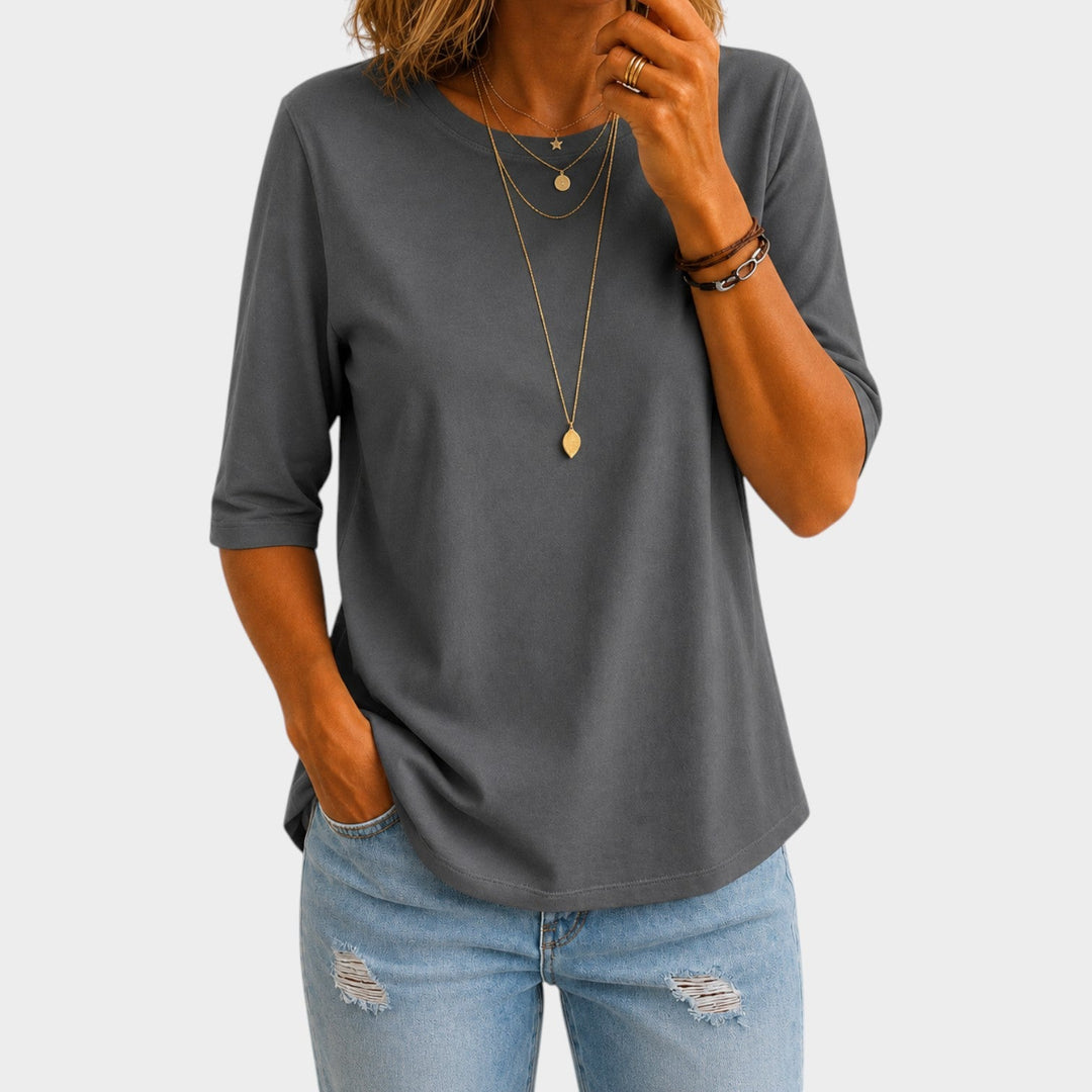 Woman wearing grey relaxed fit half sleeve t-shirt with jeans
