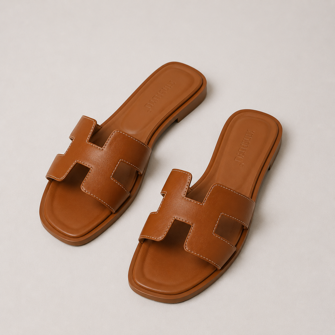 Comfortable women's orthopedic flat slide sandals for summer, shown from a side angle