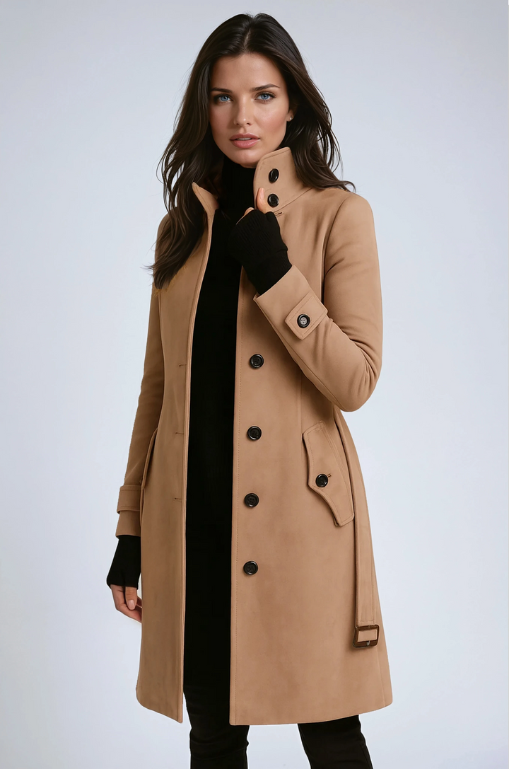 Woman wearing classic khaki longline trench coat with button closure