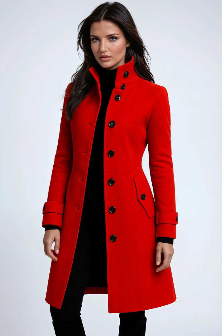 Woman wearing vibrant red longline trench coat with high collar