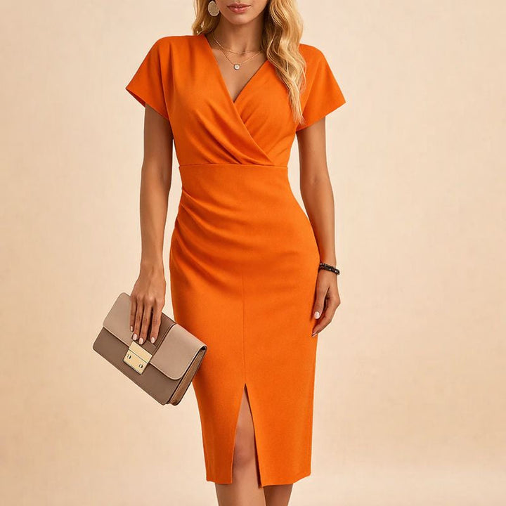 Model wearing orange V-neck midi dress with front slit holding a clutch