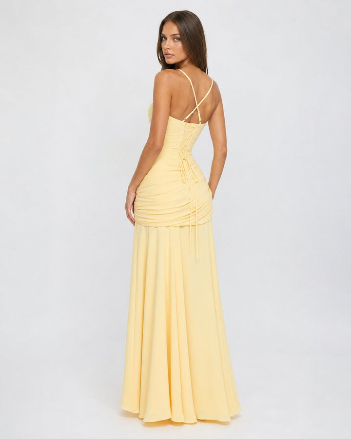 Side profile of women's ruched party maxi dress for formal wear