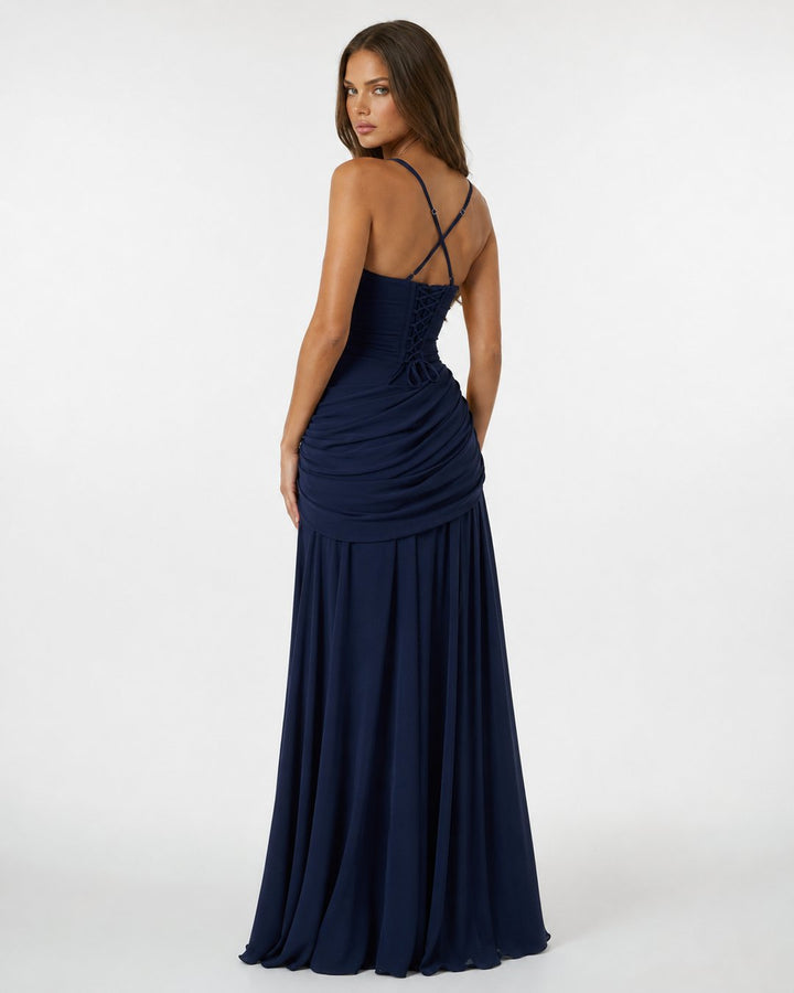 Detailed view of body-hugging ruched texture on evening dress