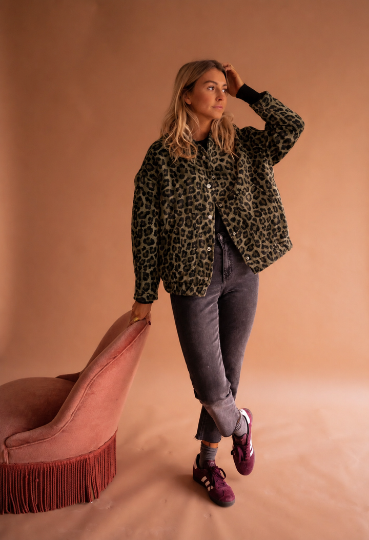 Close up of the animal print pattern and buttons on a stylish womens outerwear jacket