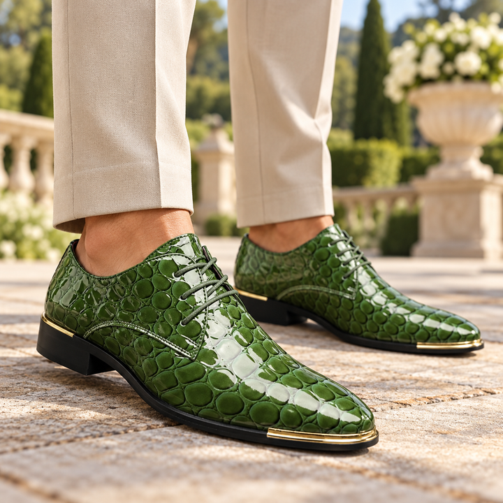 Man wearing green textured dress shoes and beige trousers outdoors