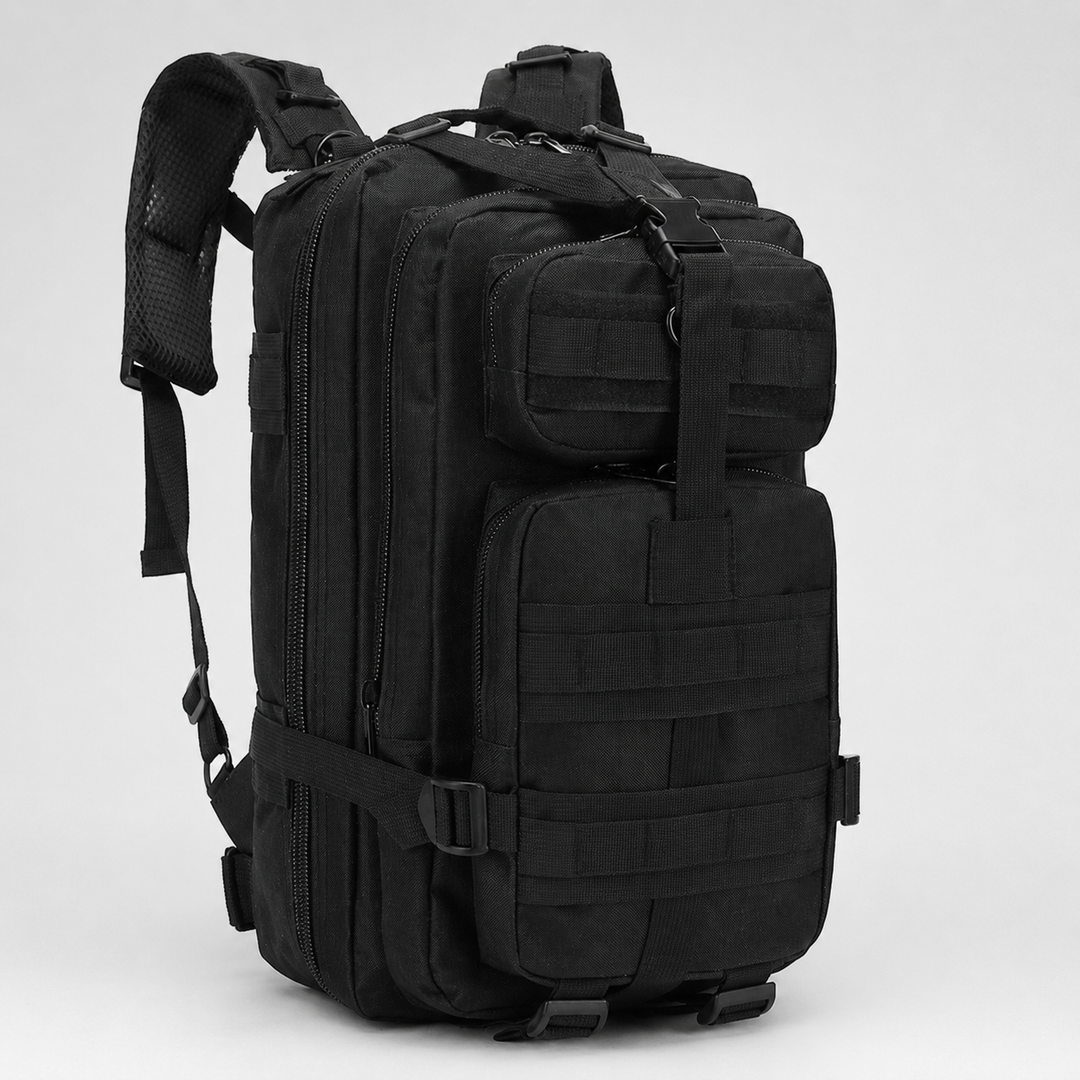 Studio shot of black tactical outdoor backpack with multiple compartments