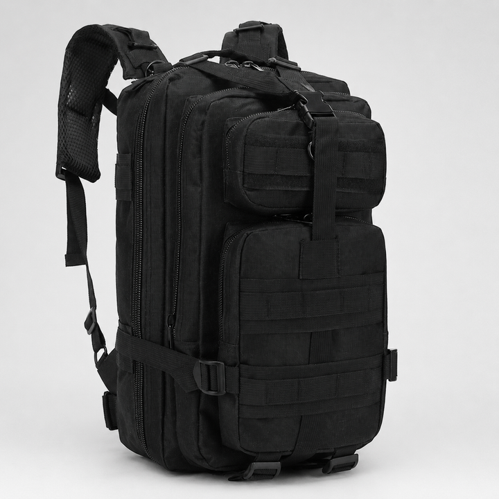 Studio shot of black tactical outdoor backpack with multiple compartments