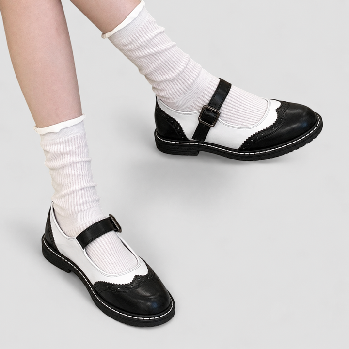 Classic black women's Mary Jane shoes featuring a comfortable low block heel and strap.