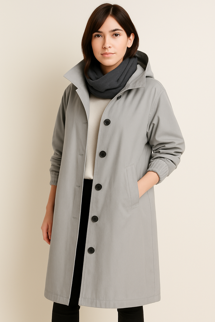 Belted waist detail on long hooded rain jacket for women