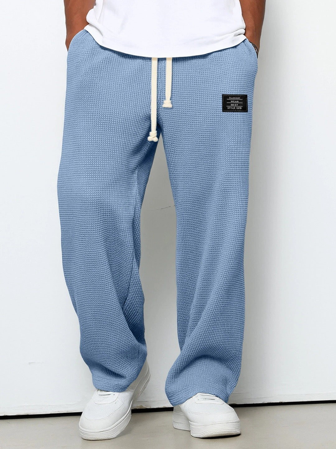 Mens relaxed fit trousers with adjustable drawstring waist in casual streetwear style