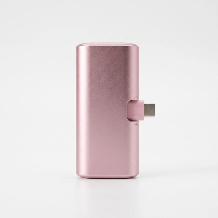 Close-up view of the built-in charging connector on the mini capsule power bank