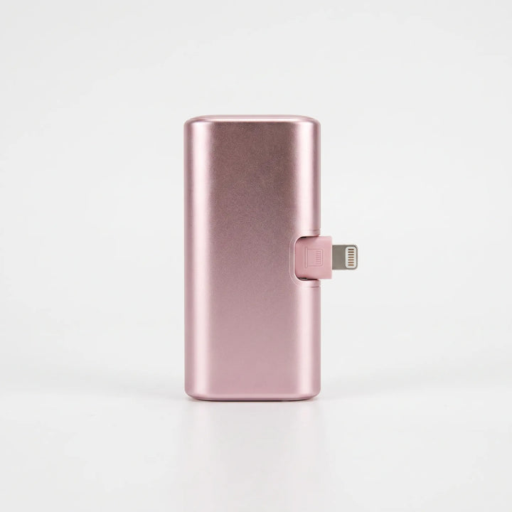 Essential travel gadget: small portable power bank held in hand for scale