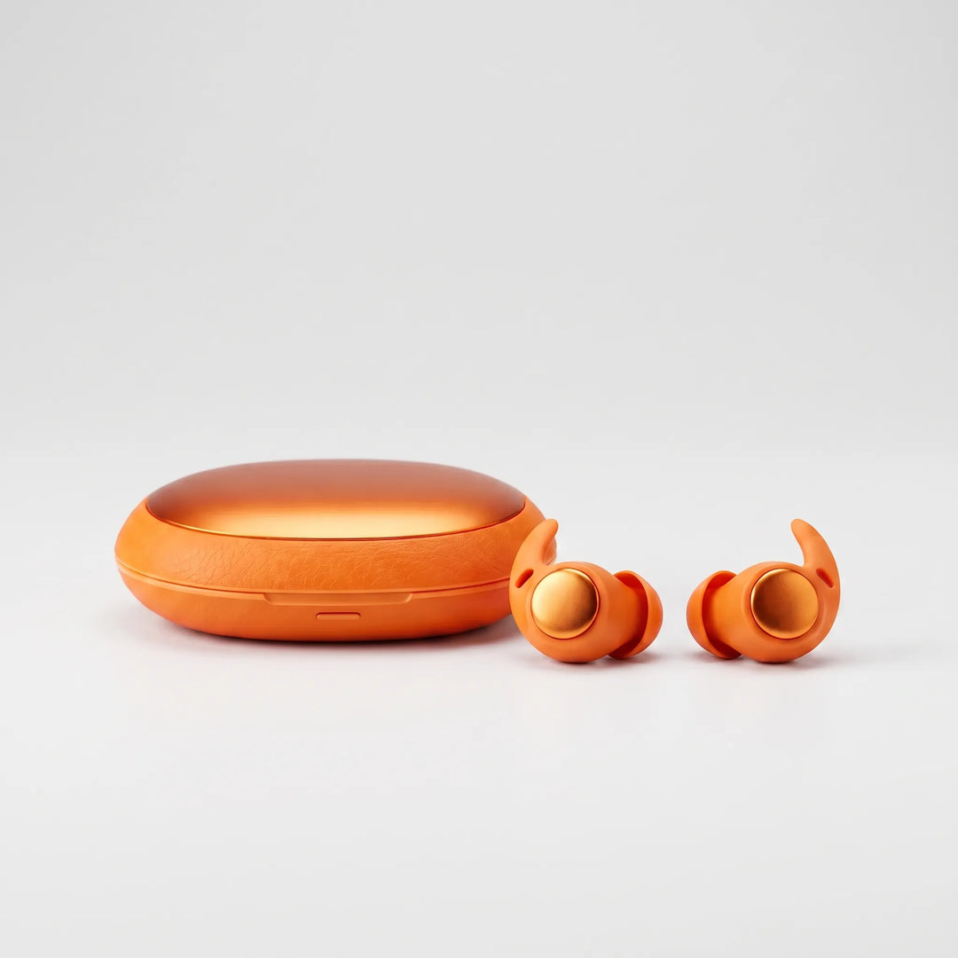 Orange wireless sleep earbuds displayed next to their matching textured charging case
