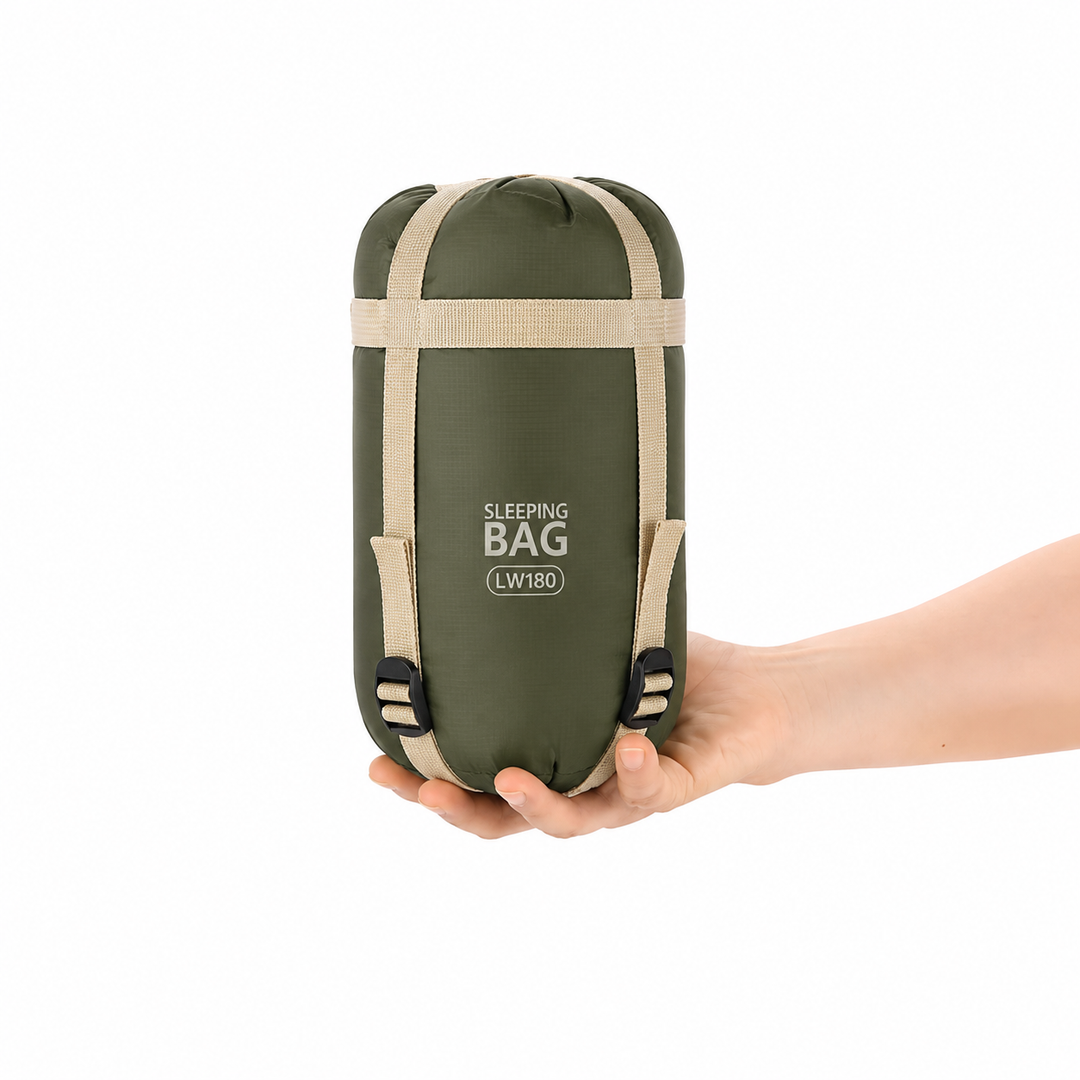 Unisex compact sleeping bag packed in its lightweight travel compression sack for hiking