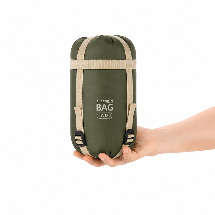 Unisex compact sleeping bag packed in its lightweight travel compression sack for hiking