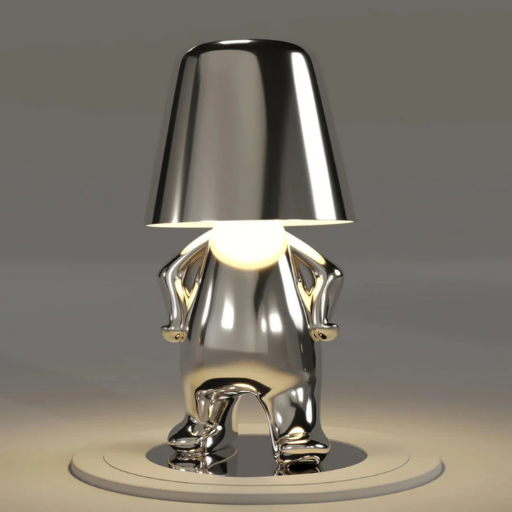 Artistic table lamp glowing brightly to accent contemporary interior design