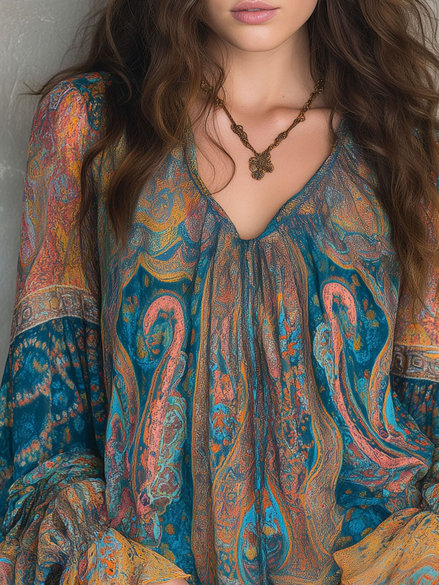 Close-up of ruffled sleeves and fabric texture on women's paisley blouse