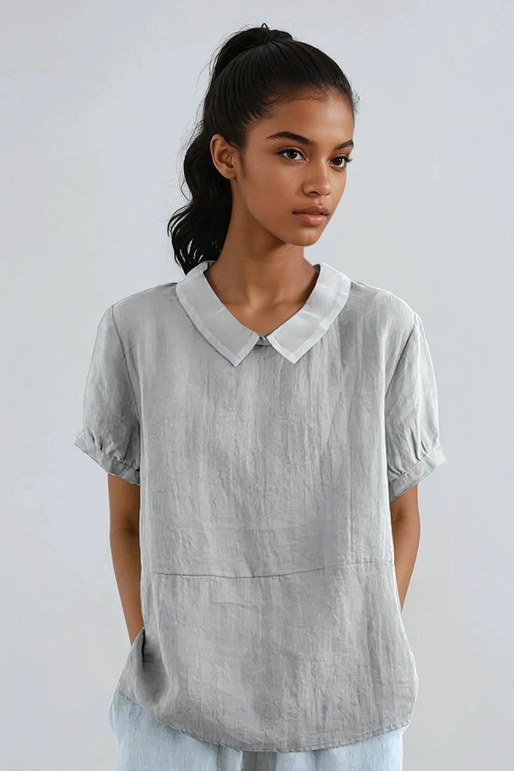 Model wearing grey women's Peter Pan collar short sleeve blouse