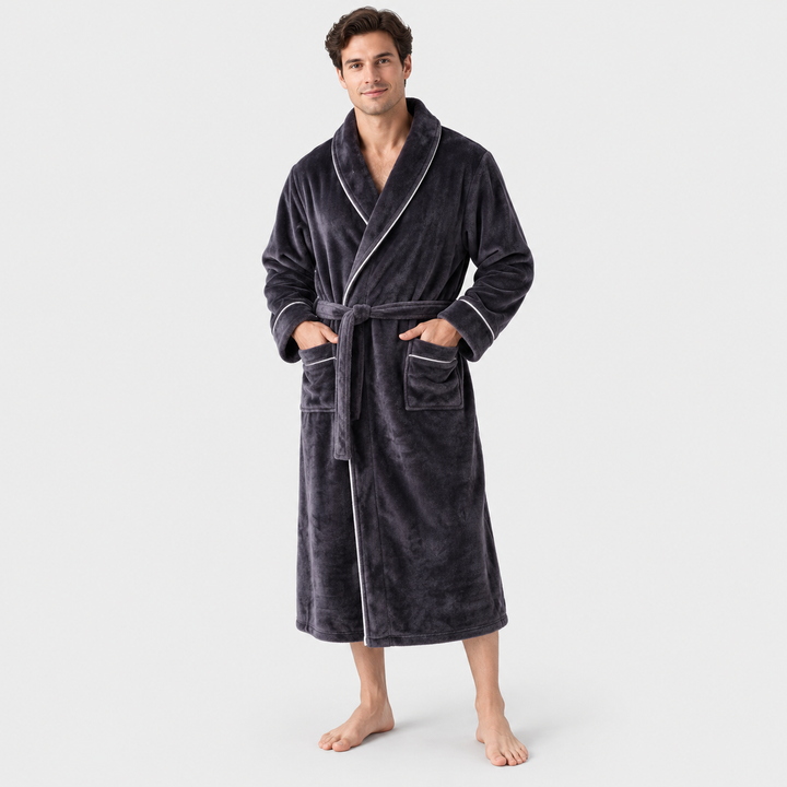 Man standing in a grey long hooded bathrobe with deep pockets