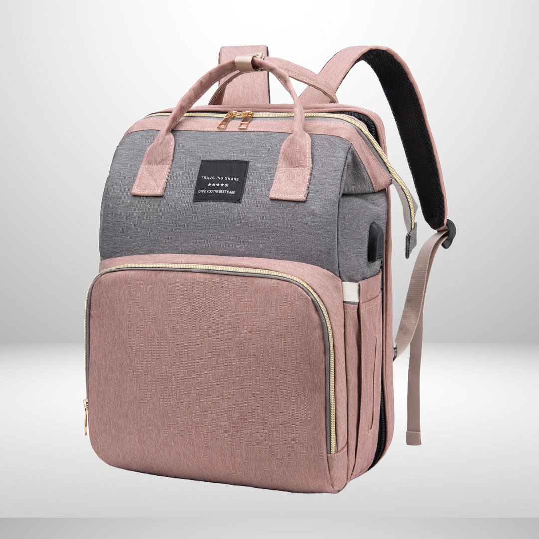 Multifunctional diaper bag backpack in grey with built-in travel bed open and ready