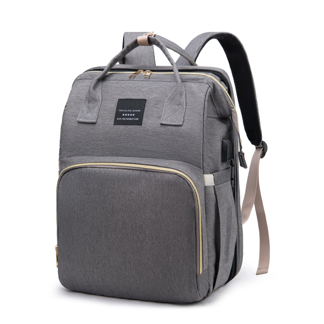 Back view of the baby bag featuring padded ergonomic shoulder straps and support mesh