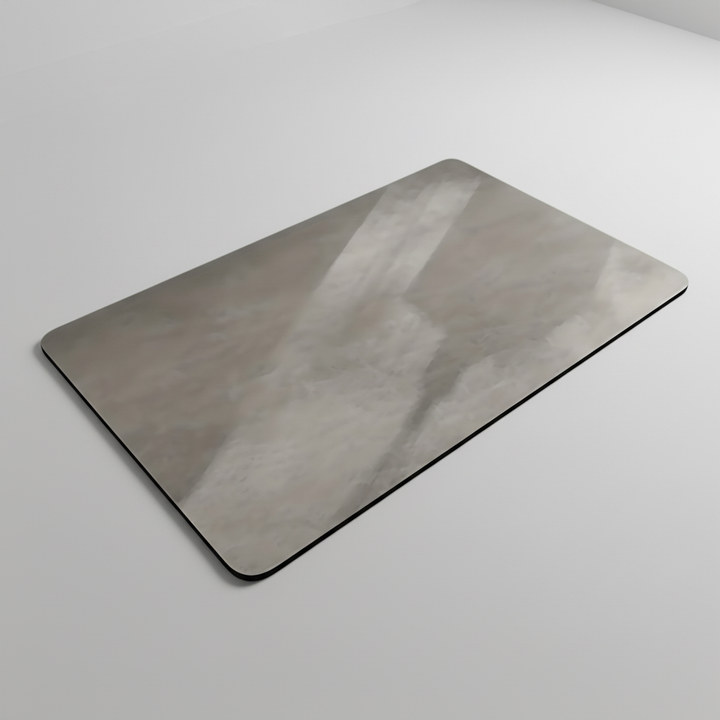 Top view of smooth surface grey diatomite stone bath mat with light reflection